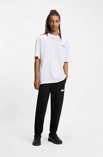 Träningsoverall BOSS Cotton-terry tracksuit bottoms with logo print Svart | 50549779, 1