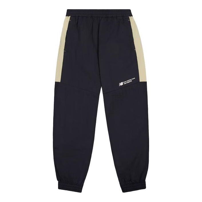 Träningsbyxor New Balance Woven Track Pants Blå | NTE24031-BK