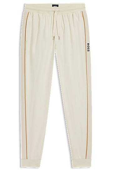 Träningsbyxor BOSS Cotton-terry tracksuit bottoms with side tape and vertical logo Beige | 50550613