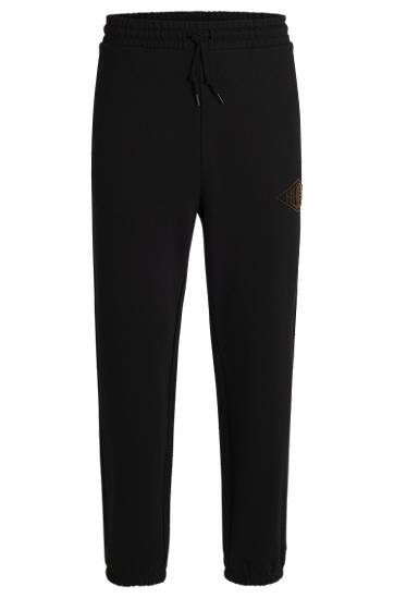 Träningsbyxor BOSS Cotton-Terry Tracksuit Bottoms with Embroidered Logo Svart | 50534952