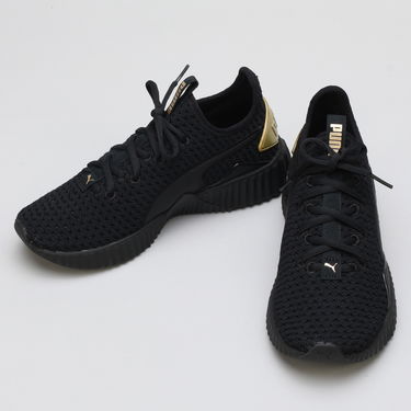 Sneakers och skor Puma Defy Varsity Wn's black - metallic gold Svart | 191148 01, 2