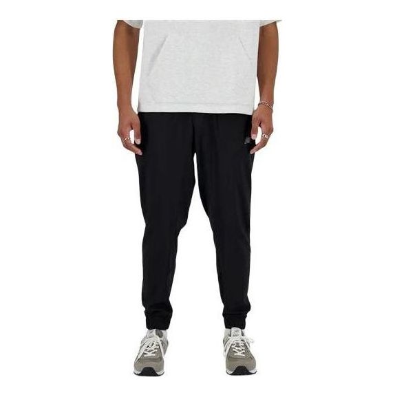 Träningsbyxor New Balance Sport Essentials Woven Joggers Svart | MP41011-BK