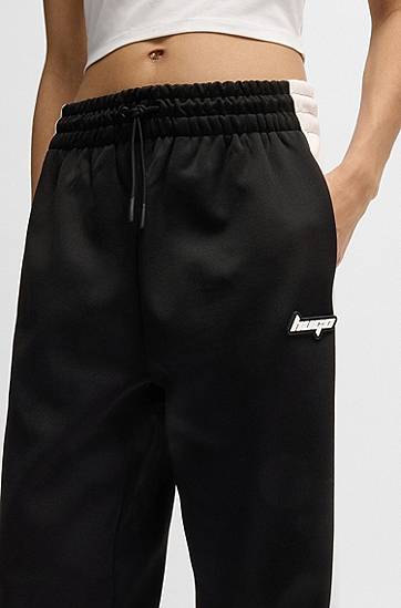 Träningsbyxor BOSS Retro Tracksuit Bottoms with Side Stripe Svart | 50537080, 1
