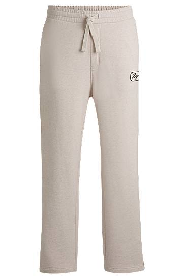 Träningsbyxor BOSS Embroidered Cotton-Terry Tracksuit Bottoms Beige | 50545938