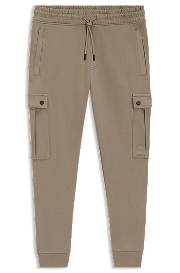 Träningsbyxor BOSS Relaxed-Fit Cotton-Terry Cargo Joggers Beige | 50542917