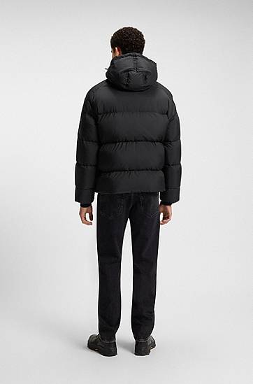 Pufferjacka BOSS Oversized-fit Hooded Puffer Jacket in Crinkle Ripstop Svart | 50543618, 1