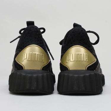 Sneakers och skor Puma Defy Varsity Wn's black - metallic gold Svart | 191148 01, 3